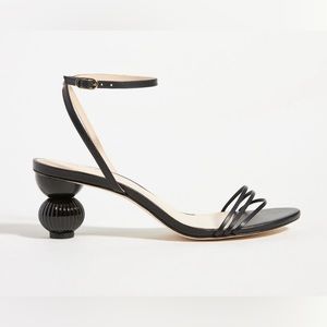 Black high heel sandals with sculptural heel.